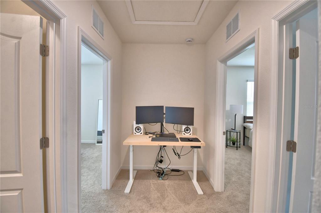 2839 Moulin Road Davenport, FL 33837 - Photo 48 of 75 a view of a workspace with furniture and a window