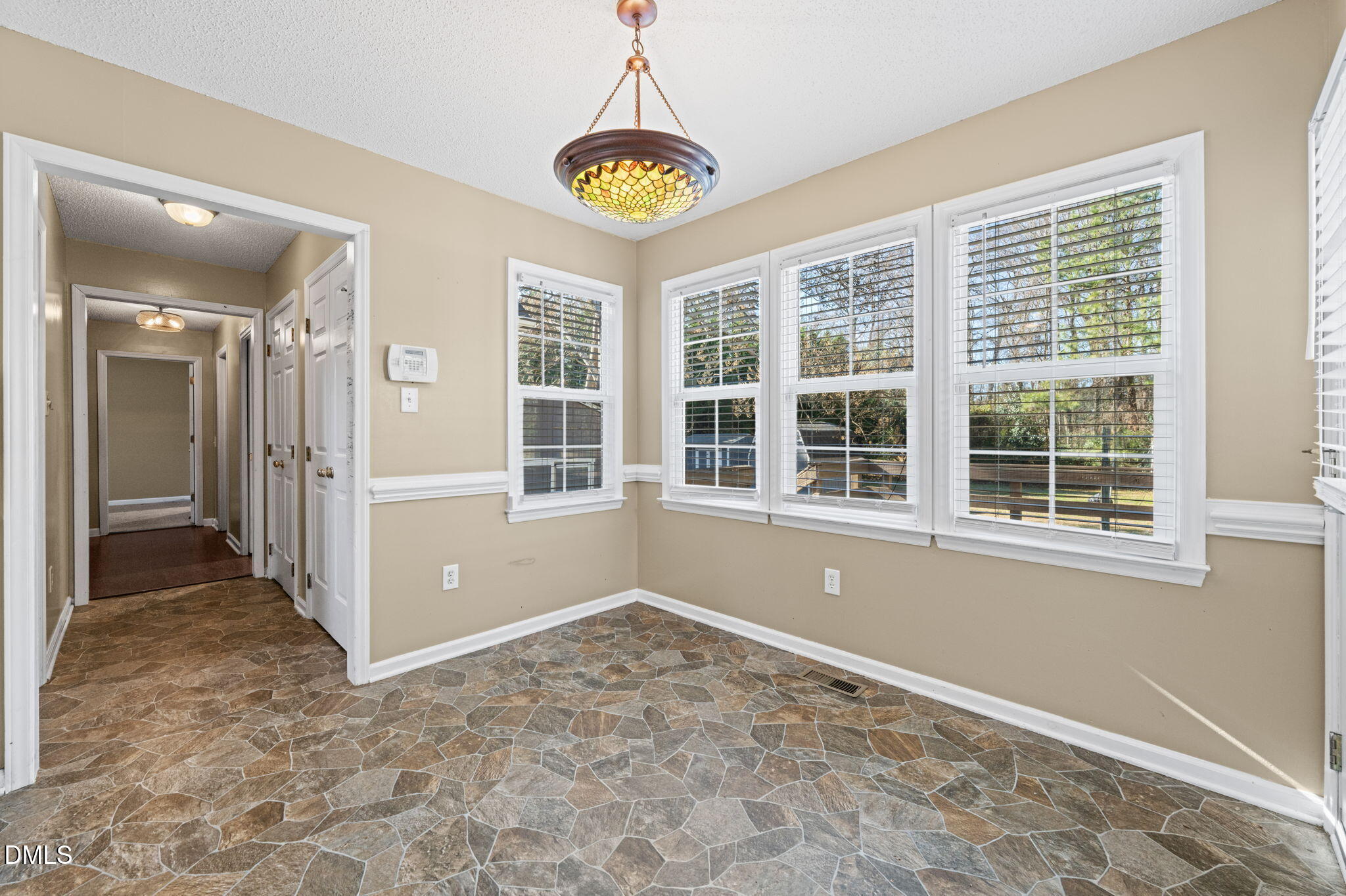 307 Laurel Ridge Drive Clayton, NC 27520 - Photo 12 of 51 a view of empty room with windows