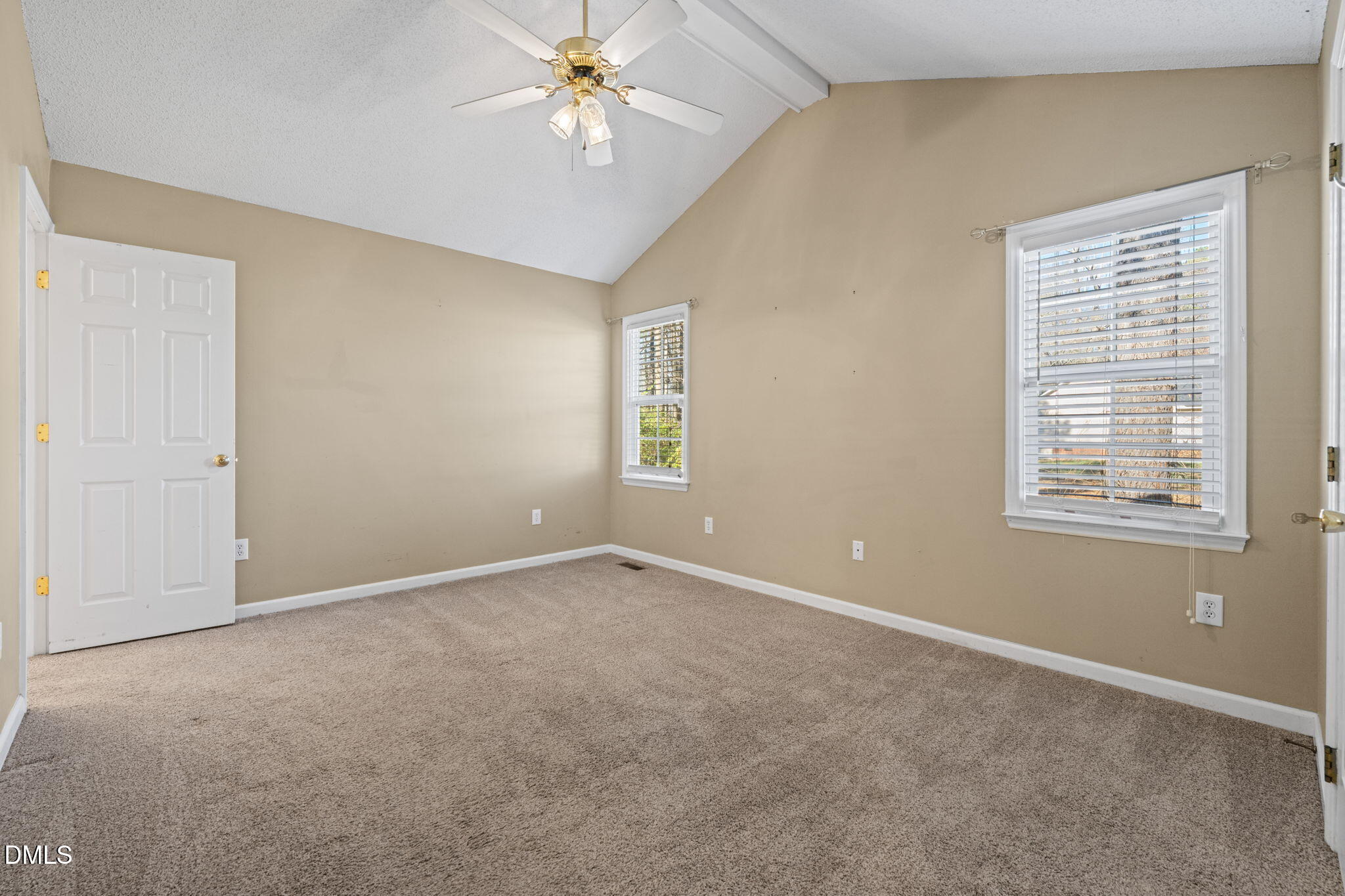 307 Laurel Ridge Drive Clayton, NC 27520 - Photo 18 of 51 an empty room with windows and fan