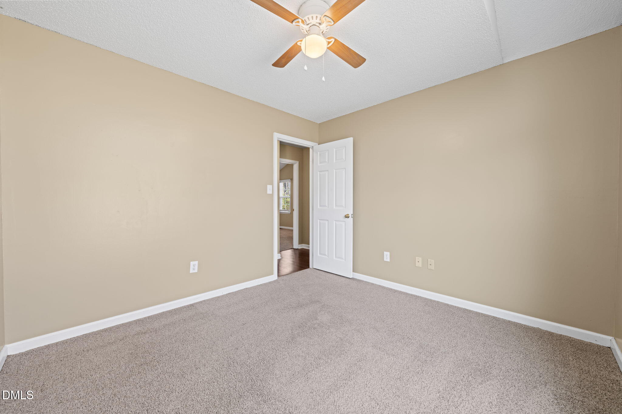 307 Laurel Ridge Drive Clayton, NC 27520 - Photo 26 of 51 an empty room with windows and fan