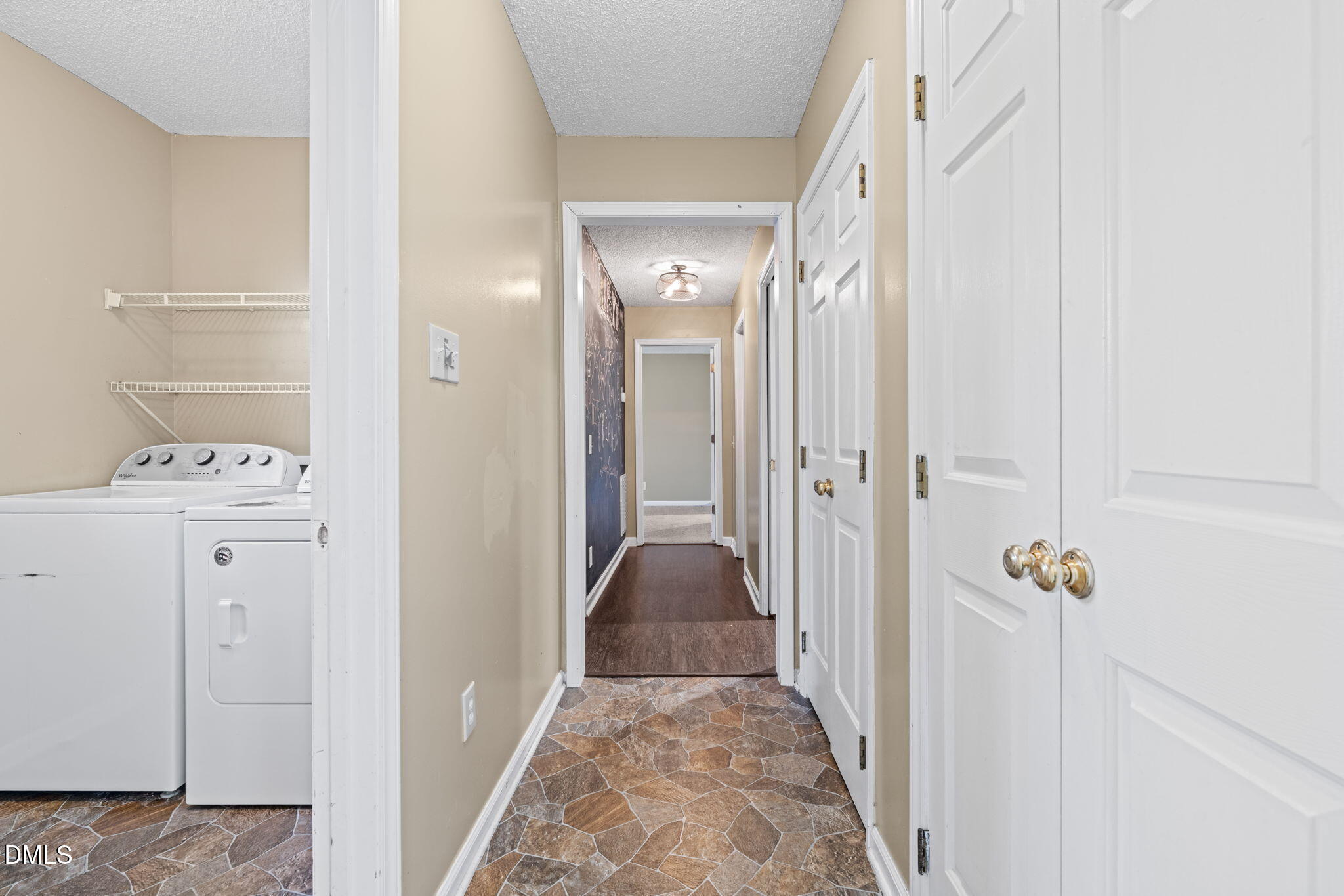 307 Laurel Ridge Drive Clayton, NC 27520 - Photo 28 of 51 a view of a hallway with closet and cabinet