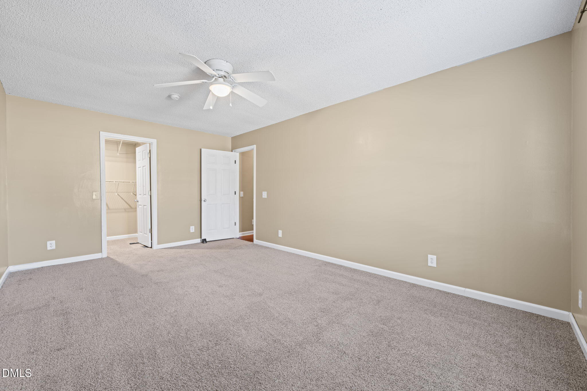 307 Laurel Ridge Drive Clayton, NC 27520 - Photo 34 of 51 an empty room with a ceiling fan and a window