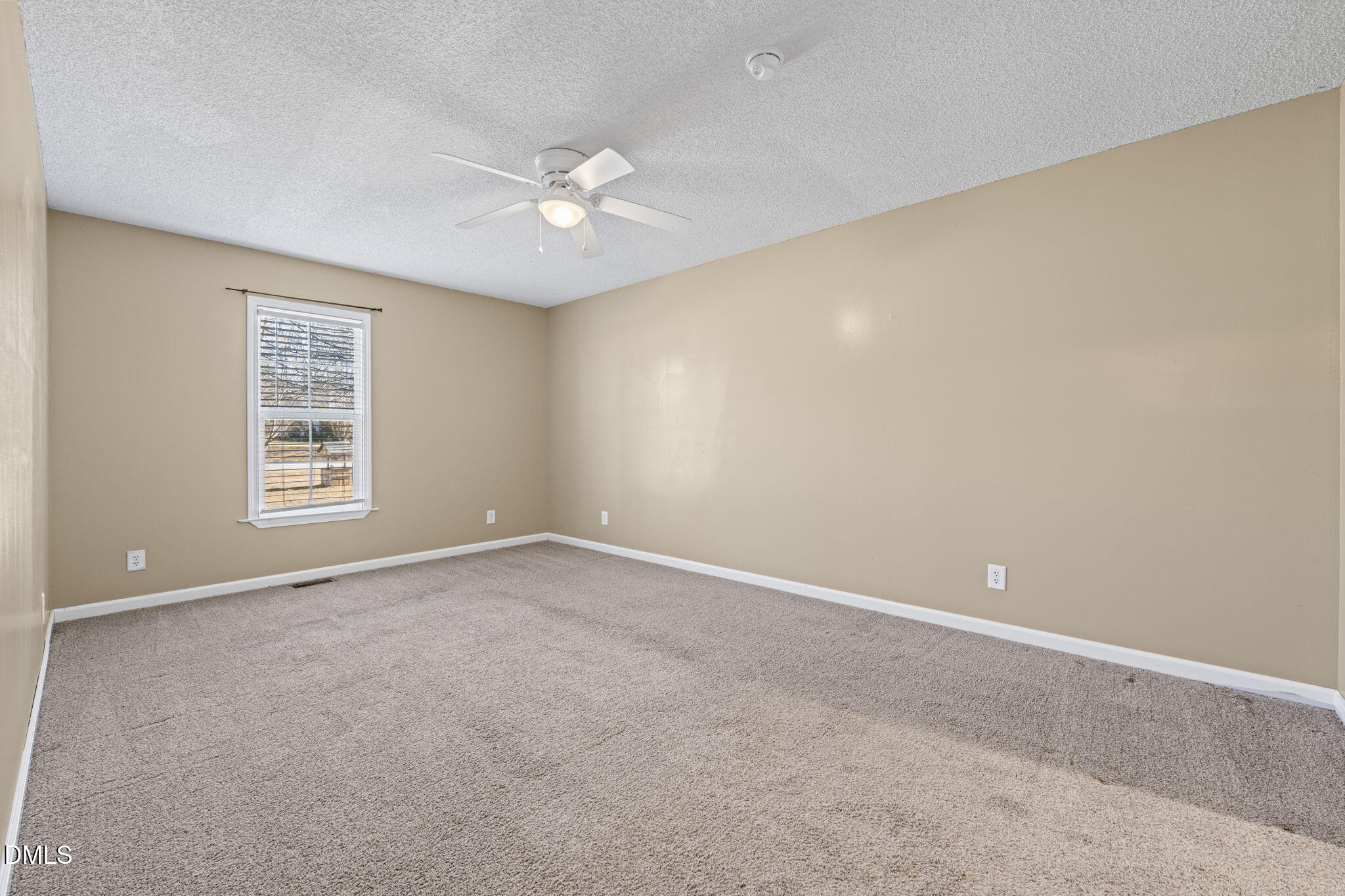 307 Laurel Ridge Drive Clayton, NC 27520 - Photo 35 of 51 a view of an empty room with a window