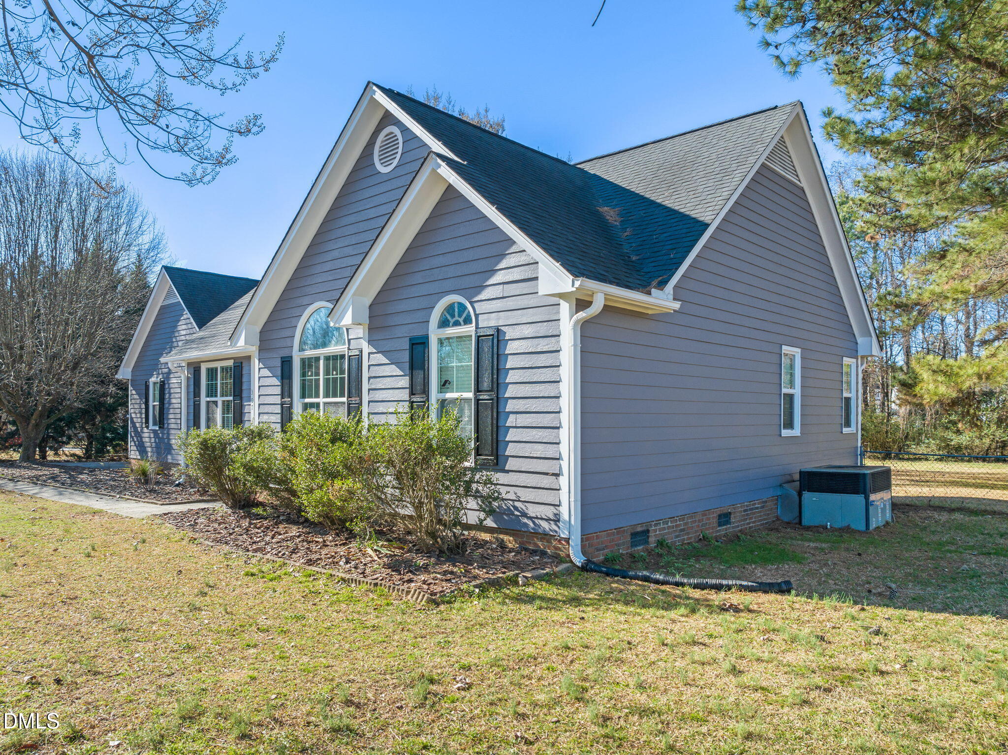 307 Laurel Ridge Drive Clayton, NC 27520 - Photo 46 of 51 a view of a house with a yard