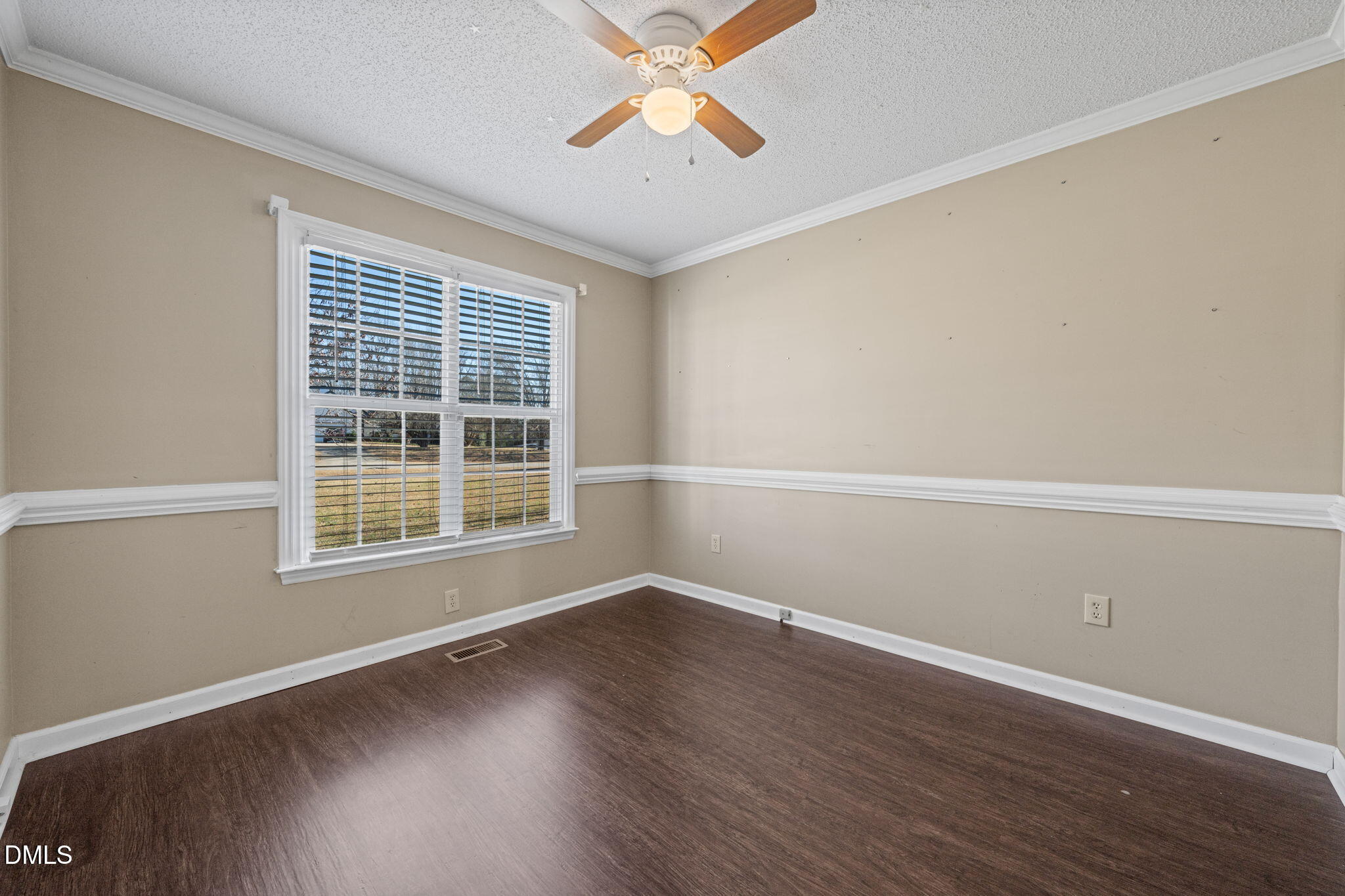 307 Laurel Ridge Drive Clayton, NC 27520 - Photo 5 of 51 an empty room with wooden floor and windows
