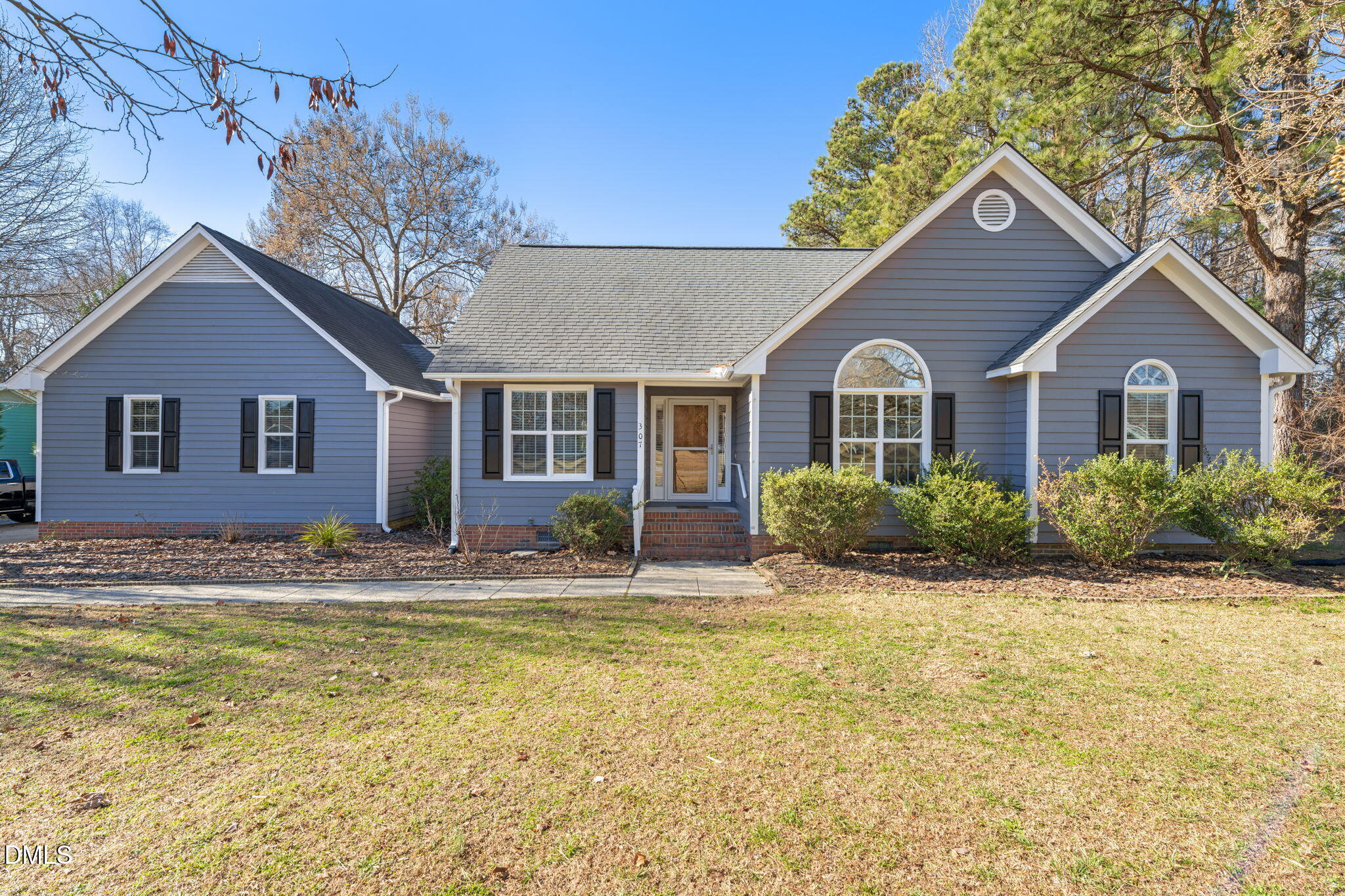 307 Laurel Ridge Drive Clayton, NC 27520 - Photo 51 of 51 a house view with a garden space