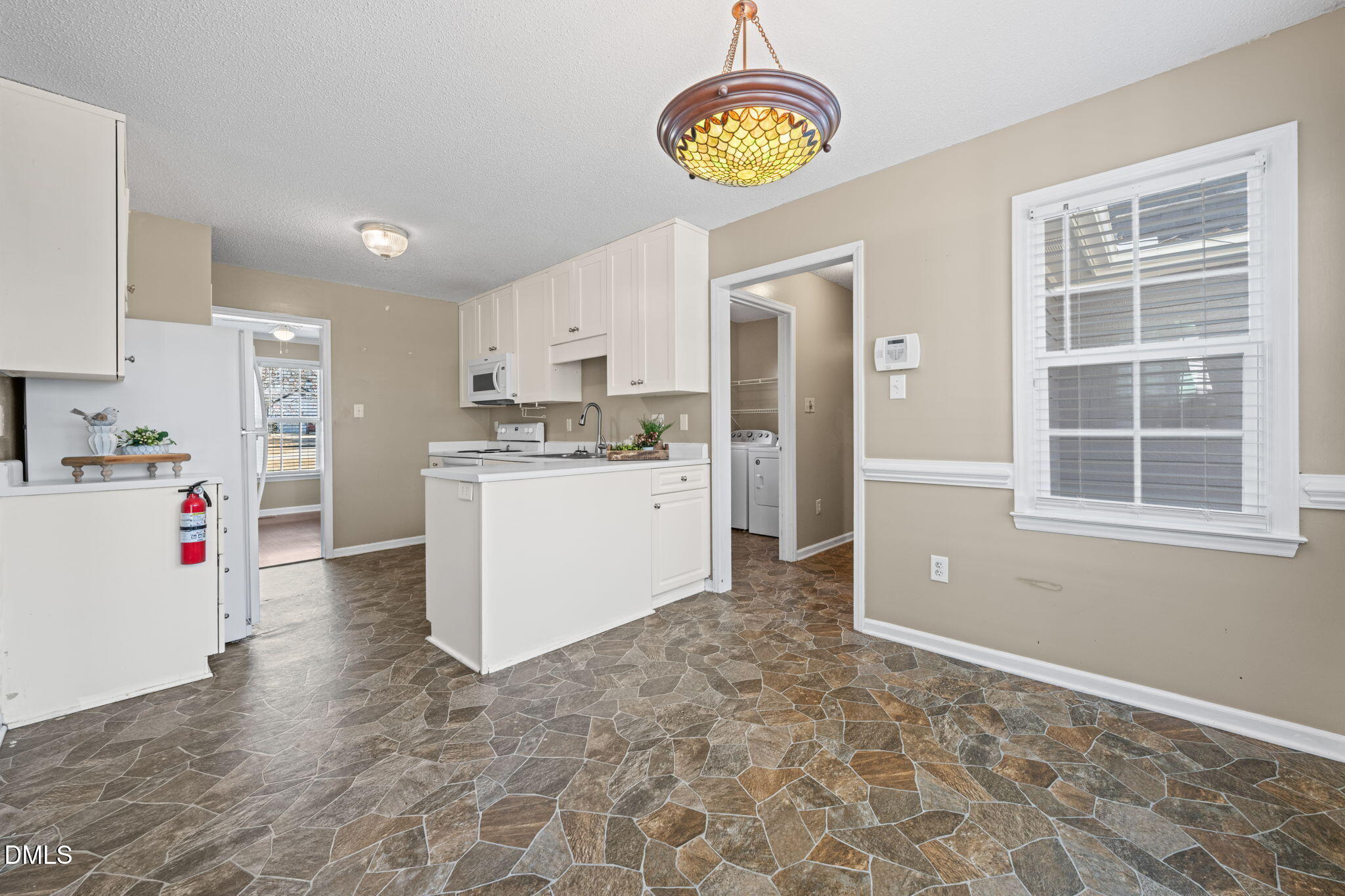 307 Laurel Ridge Drive Clayton, NC 27520 - Photo 9 of 51 a view of a kitchen with cabinets and wooden floor
