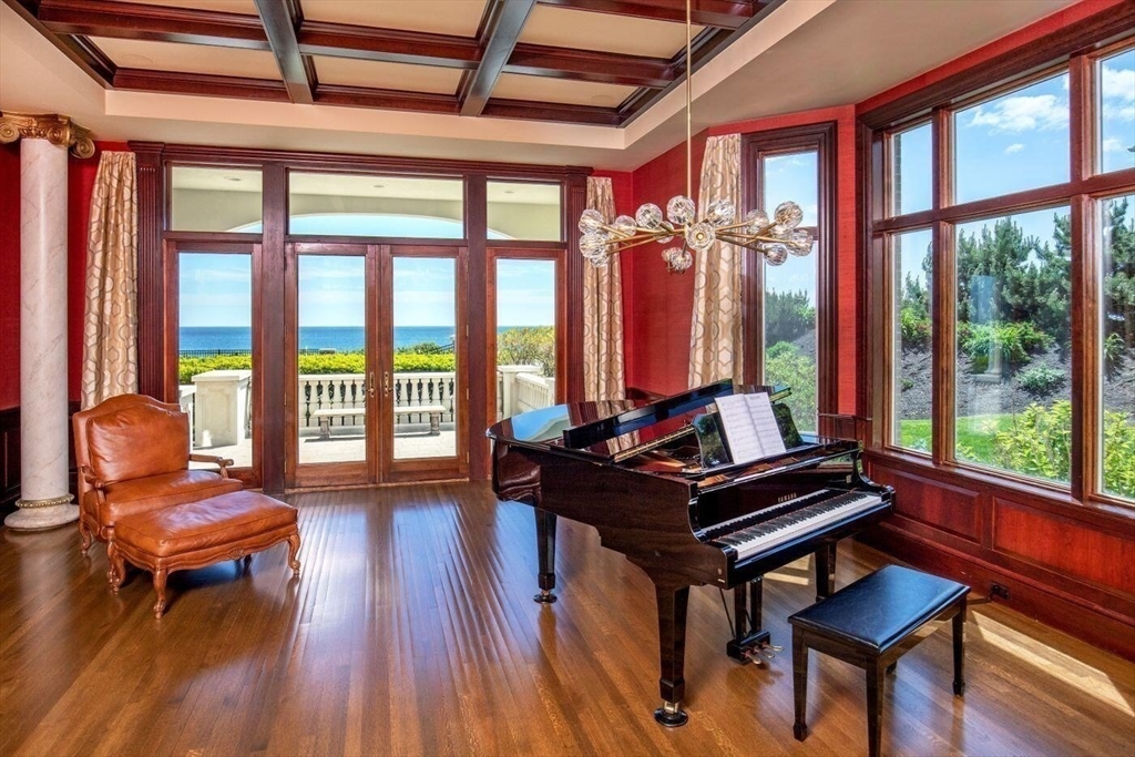 129 Atlantic Road Gloucester, MA 01930 - Photo 12 of 32 a living room with furniture a large window and wooden floor