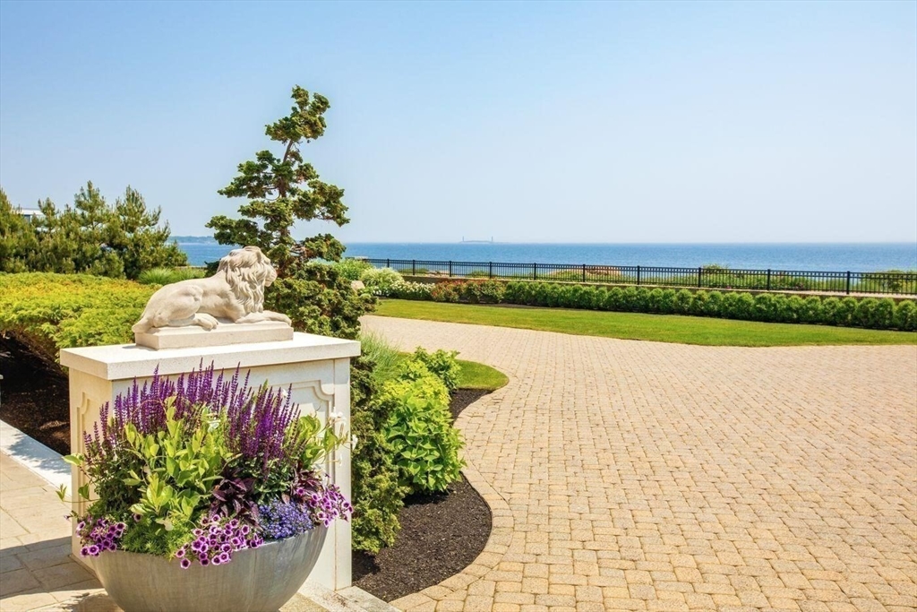 129 Atlantic Road Gloucester, MA 01930 - Photo 6 of 32 a view of a table and chair in the garden