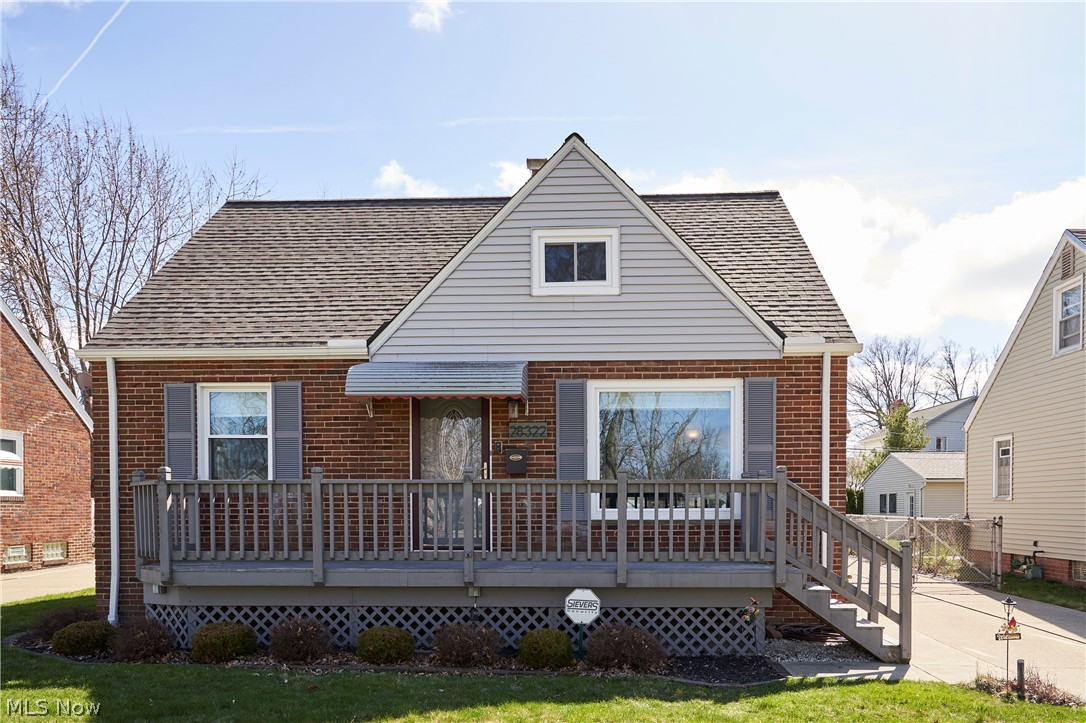 Bungalow-style house with a front yard