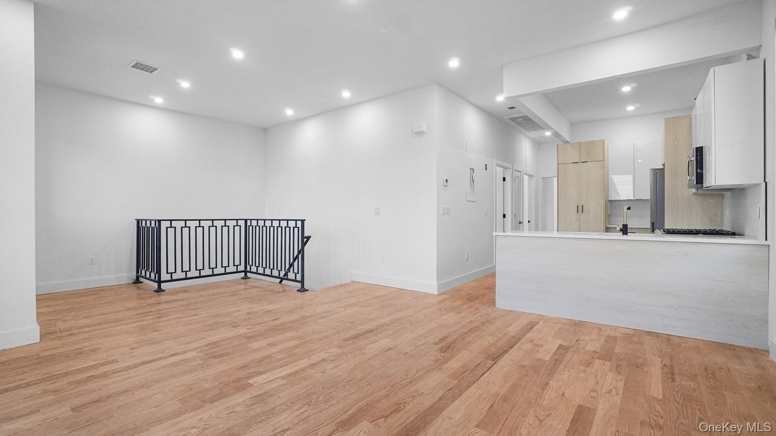 3239 Tierney Place Bronx, NY 10465 - Photo 15 of 31 Unfurnished living room with recessed lighting and light wood-style flooring