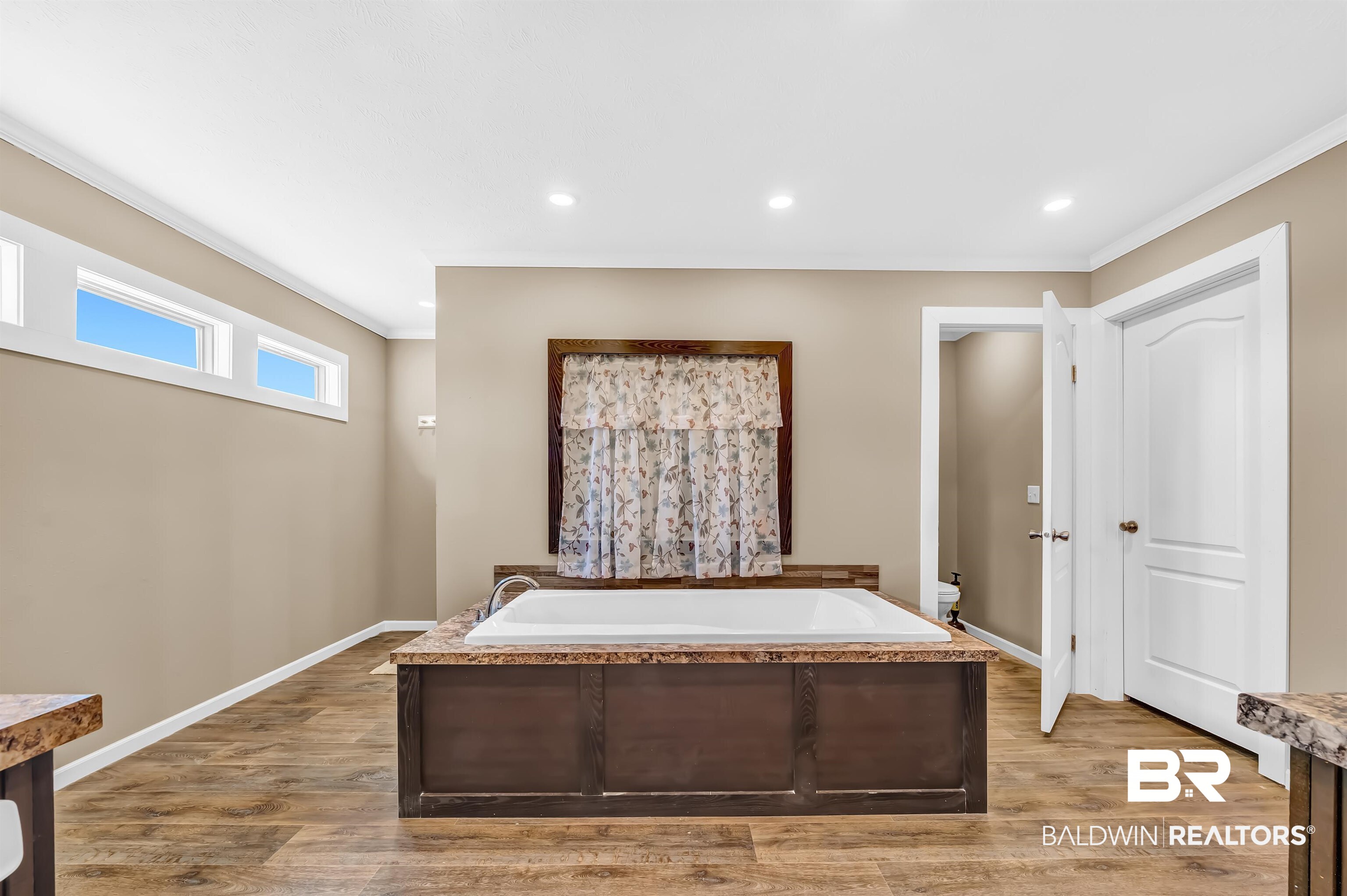 23233 Forland Road Silverhill, AL 36576 - Photo 21 of 33 Unfurnished bedroom featuring light wood-style flooring, ornamental molding, and baseboards