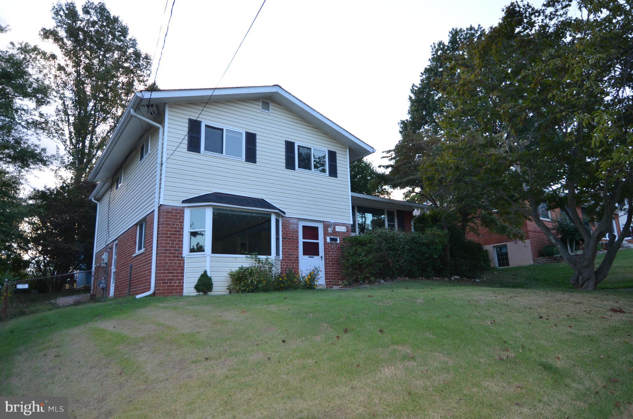 11806 Selfridge Road Silver Spring, MD 20906 - Photo 2 of 25 a front view of house with yard and green space