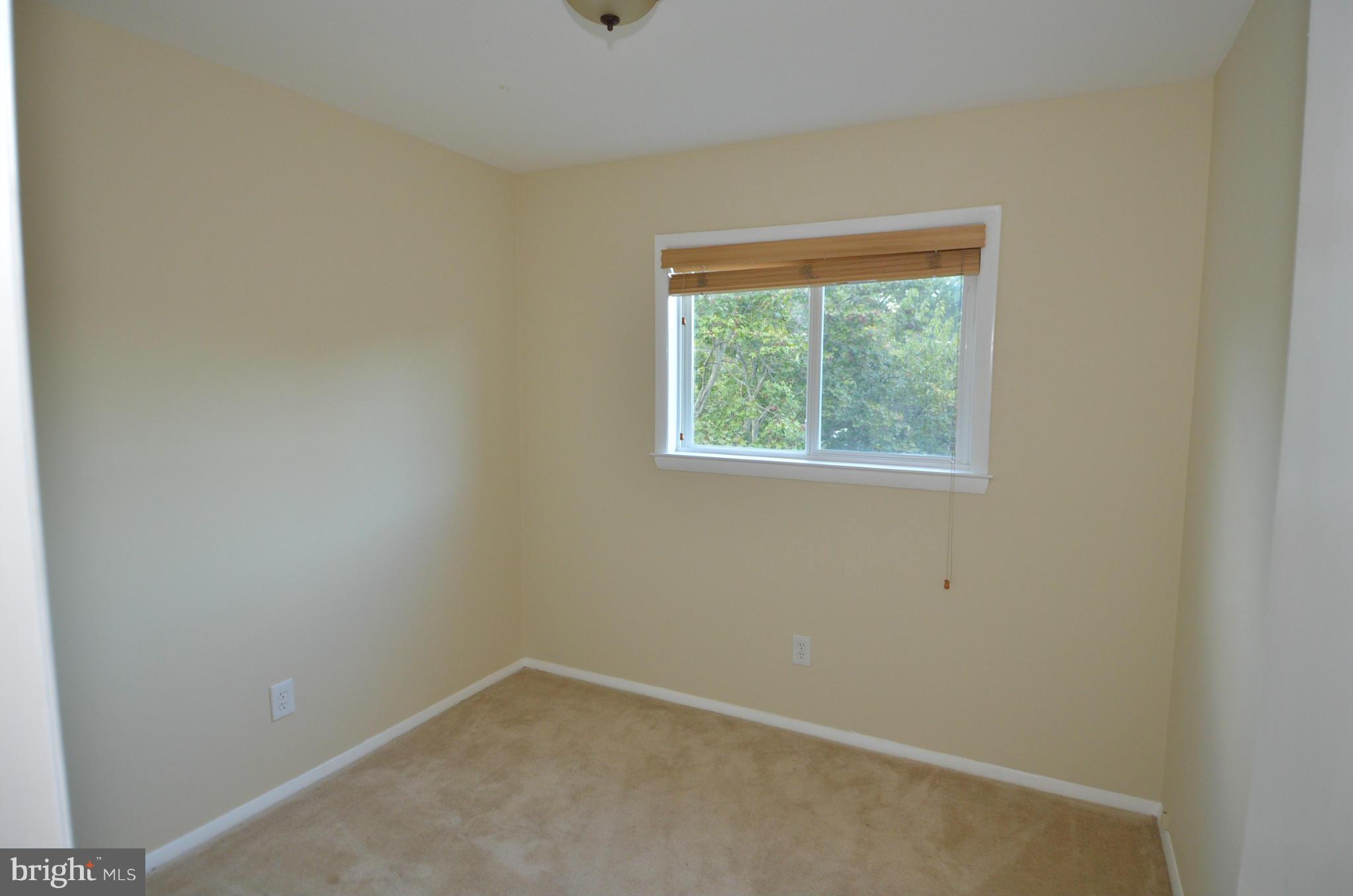 11806 Selfridge Road Silver Spring, MD 20906 - Photo 16 of 25 an empty room with a window