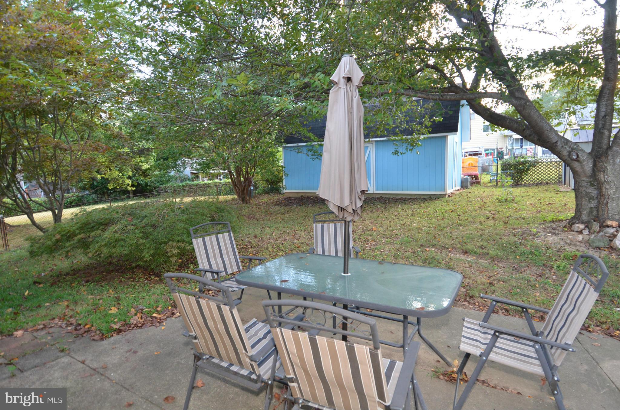 11806 Selfridge Road Silver Spring, MD 20906 - Photo 25 of 25 a backyard of a house with table and chairs