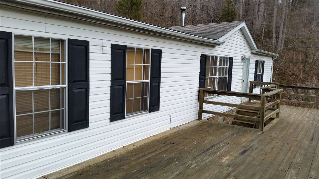 1733 Mutton Hollow Road Stanardsville, VA 22973 - Photo 12 of 12 a view of a house with a large window and wooden floor