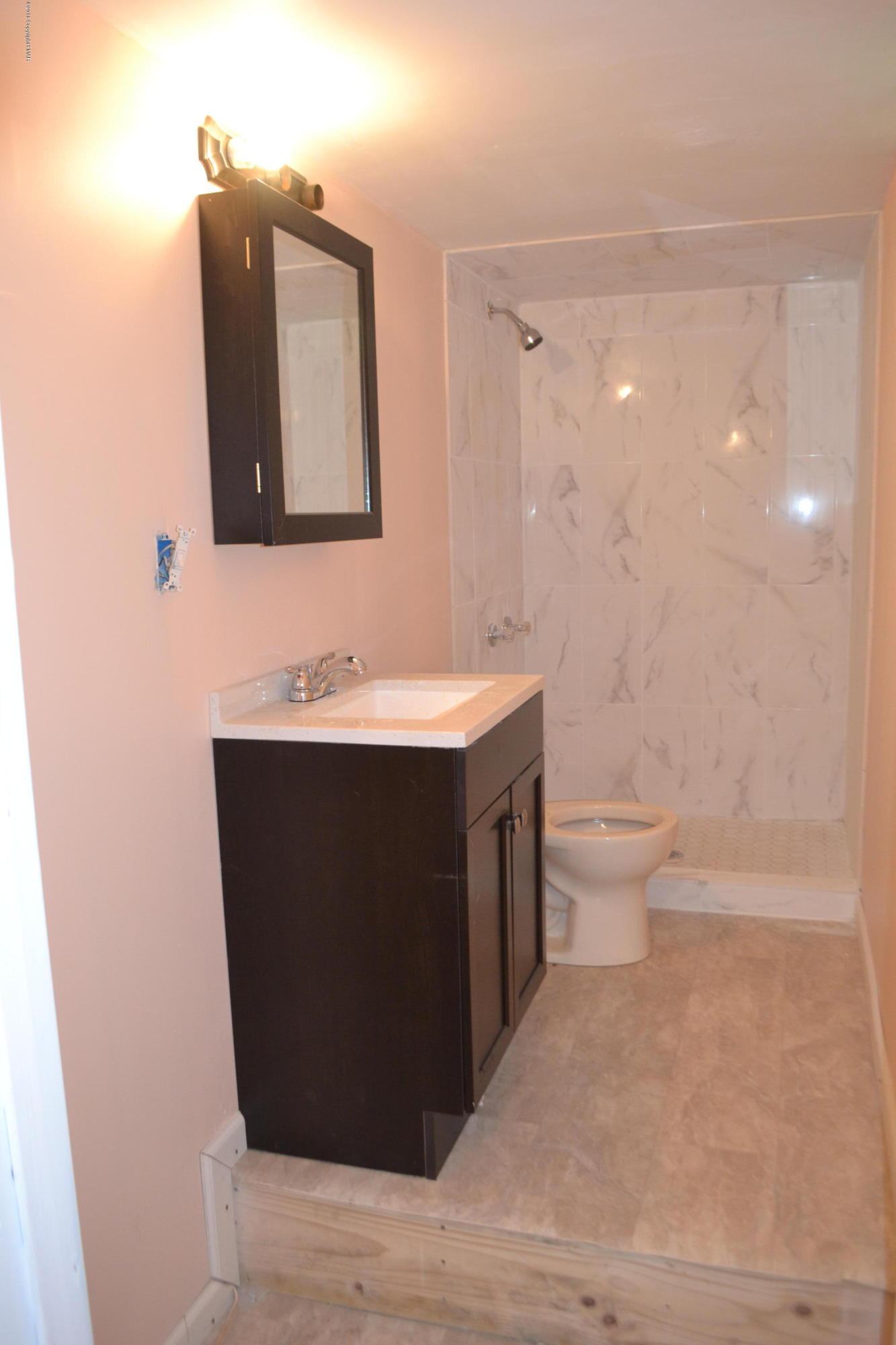 1015 Clover Road Long Pond, PA 18334 - Photo 27 of 35 a bathroom with a sink a toilet and mirror