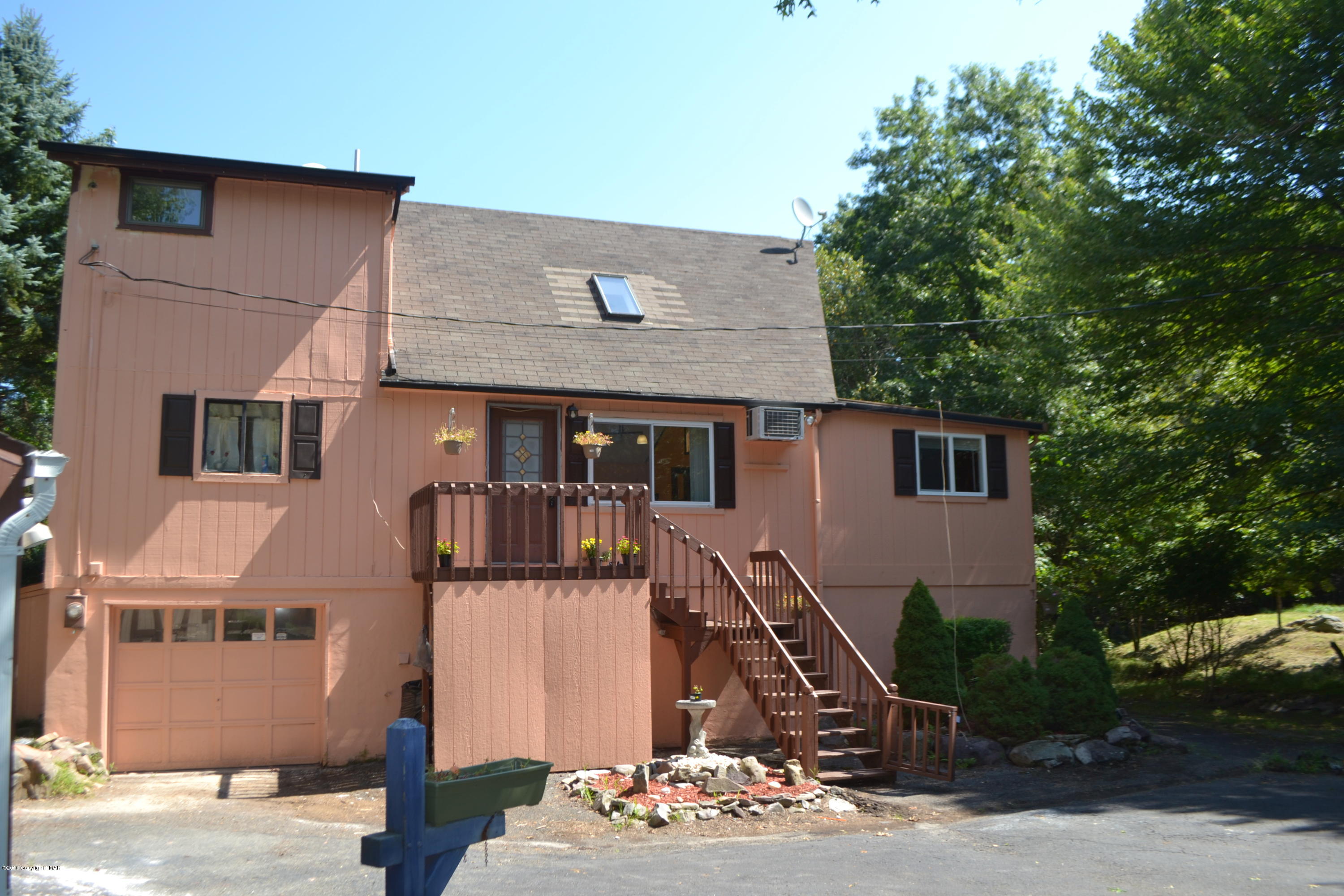 1015 Clover Road Long Pond, PA 18334 - Photo 31 of 35 a front view of a house with a tree