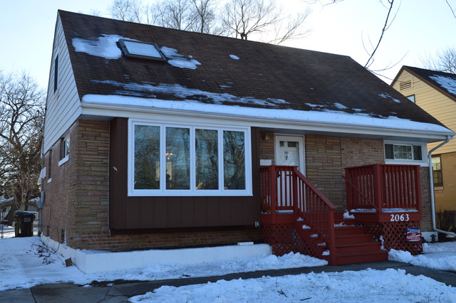 a view of house with backyard outdoor seating and barbeque