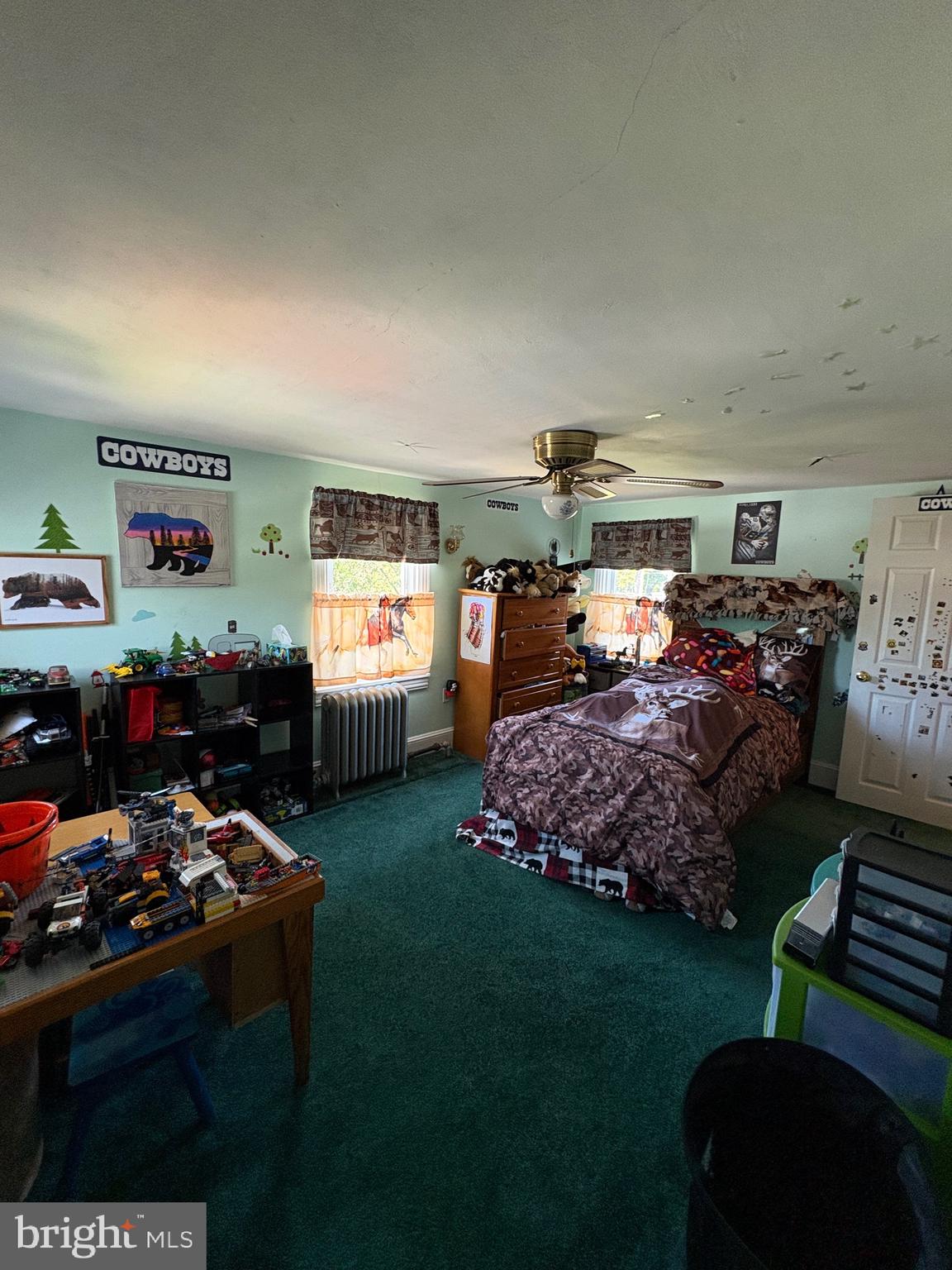 909 Main Street Salem, NJ 08079 - Photo 24 of 35 a bed room with furniture a flat screen tv and a window