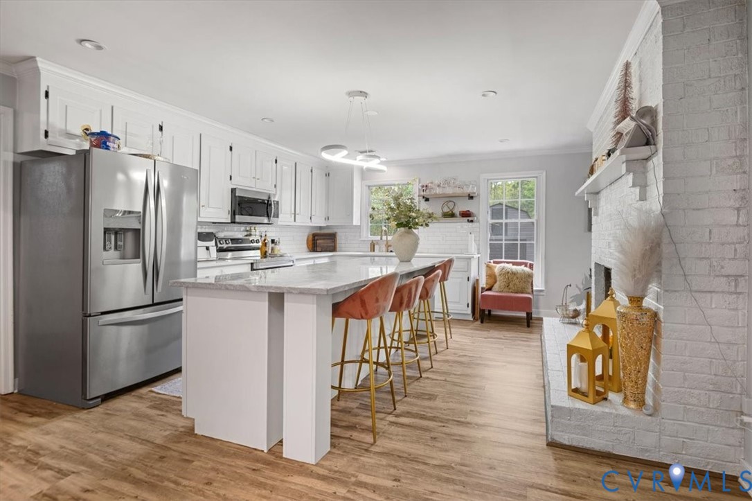 9820 Beaver Bridge Road Chesterfield, VA 23838 - Photo 12 of 51 The kitchen features white cabinetry, stainless st