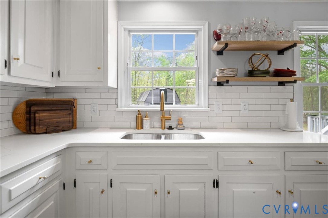 9820 Beaver Bridge Road Chesterfield, VA 23838 - Photo 19 of 51 The kitchen features white cabinetry with gold har