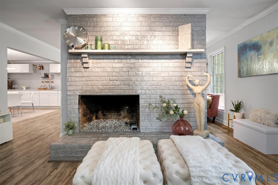 9820 Beaver Bridge Road Chesterfield, VA 23838 - Photo 24 of 51 The living room features a prominent brick gas fir