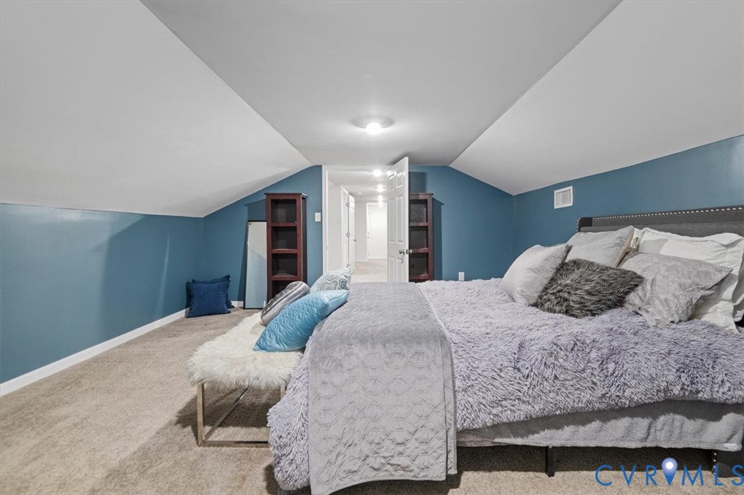 9820 Beaver Bridge Road Chesterfield, VA 23838 - Photo 34 of 51 Bedroom with sloped ceilings and plush carpet floo