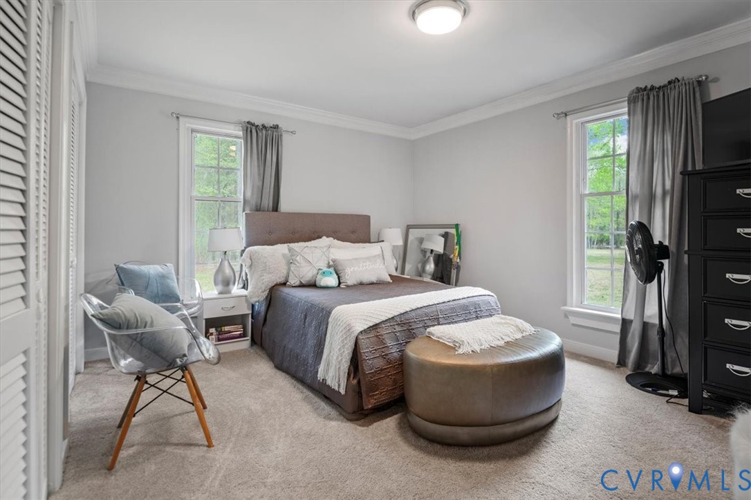 9820 Beaver Bridge Road Chesterfield, VA 23838 - Photo 35 of 51 This bedroom features light gray walls, a textured