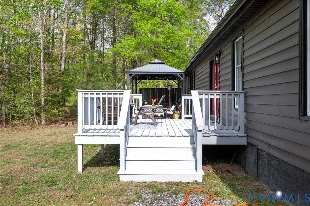 9820 Beaver Bridge Road Chesterfield, VA 23838 - Photo 45 of 51 The property features an outdoor deck with white r