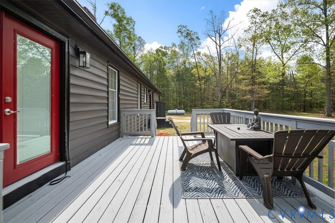 9820 Beaver Bridge Road Chesterfield, VA 23838 - Photo 47 of 51 The property features a large deck with a railing,