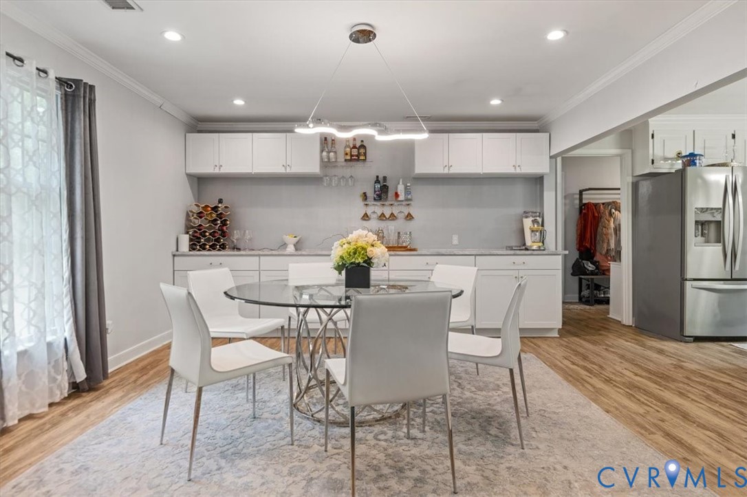 9820 Beaver Bridge Road Chesterfield, VA 23838 - Photo 8 of 51 The dining area features wood-style flooring and r