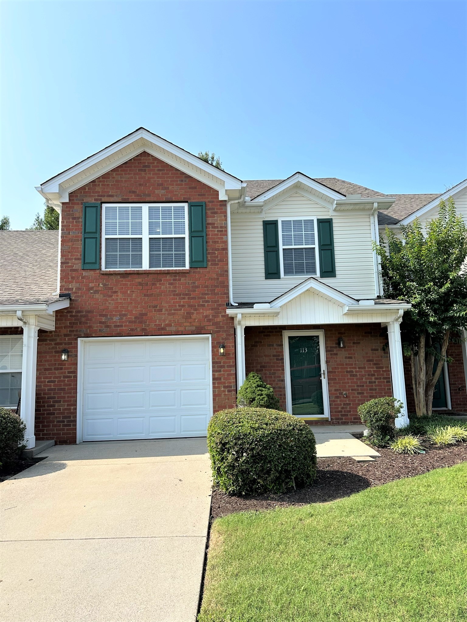 113 Lancaster Gate Place Murfreesboro, TN 37128 - Photo 1 of 28 a front view of a house with a yard and garage