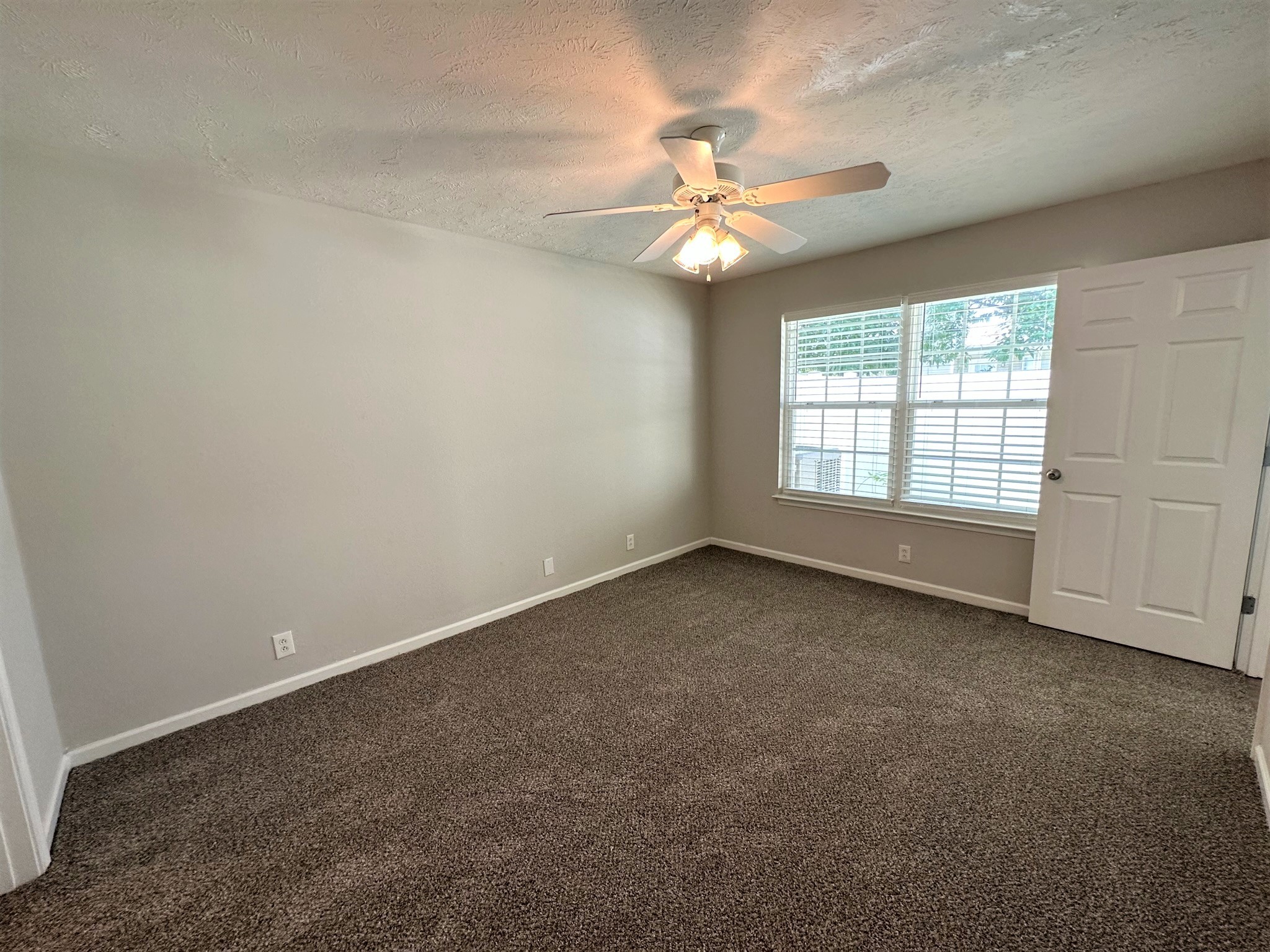 113 Lancaster Gate Place Murfreesboro, TN 37128 - Photo 12 of 28 an empty room with a window and a fan