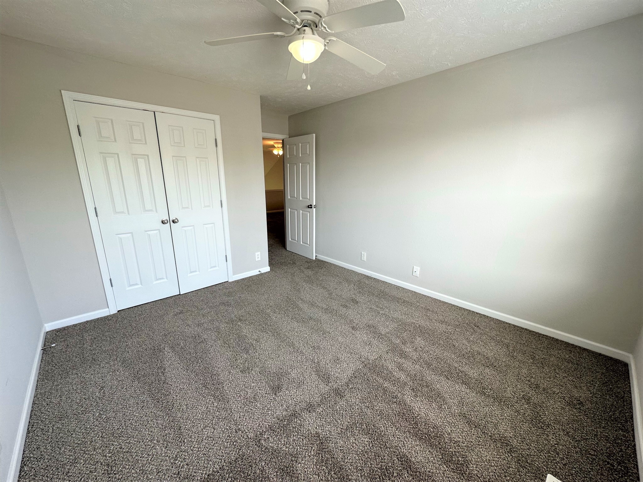 113 Lancaster Gate Place Murfreesboro, TN 37128 - Photo 19 of 28 an empty room with a ceiling fan and closet area
