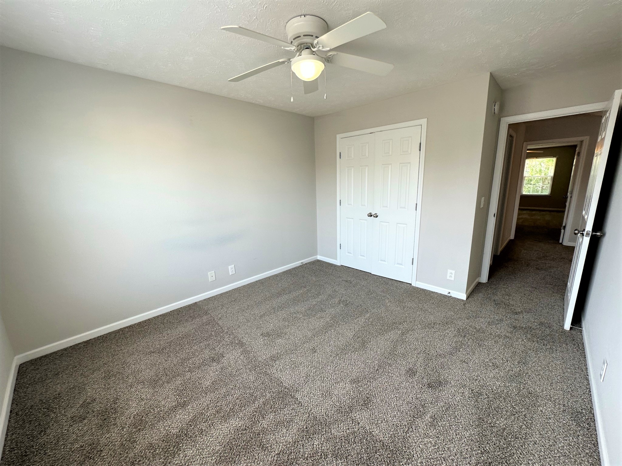 113 Lancaster Gate Place Murfreesboro, TN 37128 - Photo 20 of 28 an empty room with closet and a chandelier fan