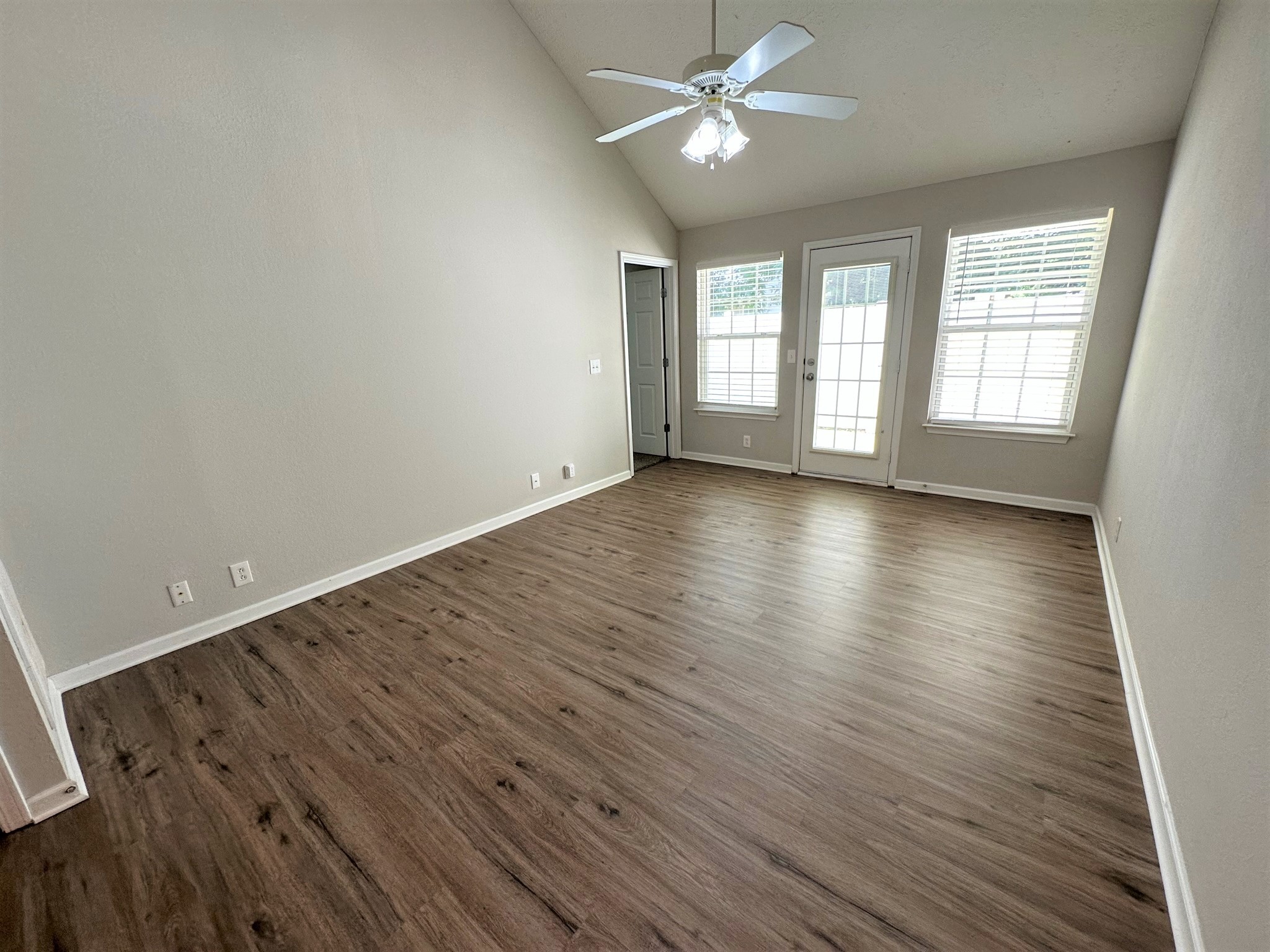 113 Lancaster Gate Place Murfreesboro, TN 37128 - Photo 4 of 28 an empty room with wooden floor fan and windows