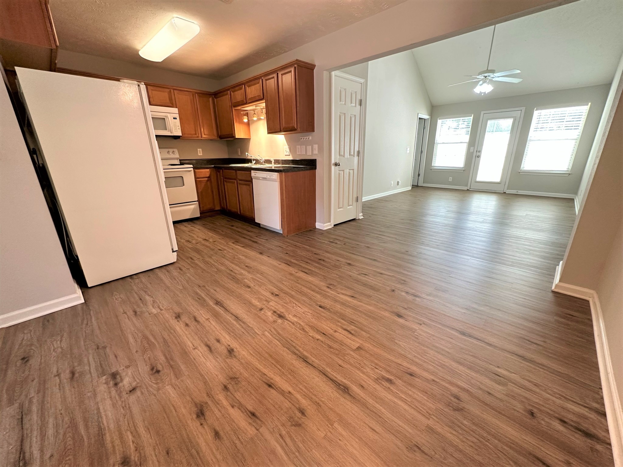 113 Lancaster Gate Place Murfreesboro, TN 37128 - Photo 6 of 28 a kitchen with stainless steel appliances wooden floors and refrigerator