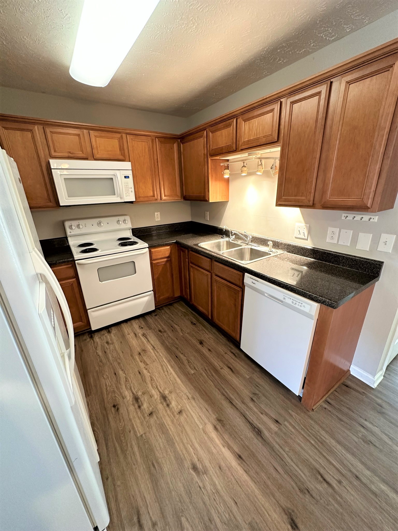 113 Lancaster Gate Place Murfreesboro, TN 37128 - Photo 7 of 28 a kitchen with stainless steel appliances granite countertop a stove a sink and a refrigerator
