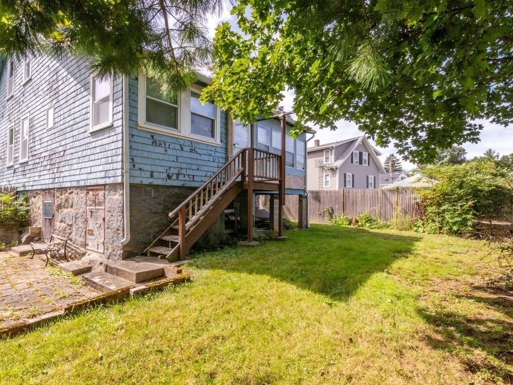 12 Carter Road Braintree, MA 02184 - Photo 11 of 34 a view of a house with a backyard