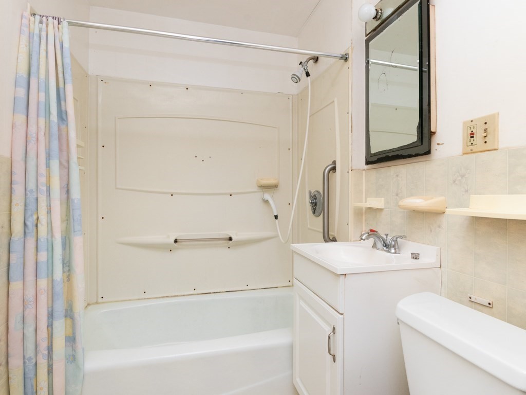 12 Carter Road Braintree, MA 02184 - Photo 27 of 34 a bathroom with a sink a toilet and a bathtub