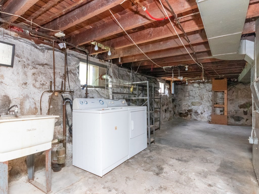 12 Carter Road Braintree, MA 02184 - Photo 28 of 34 a utility room with dryer and washer