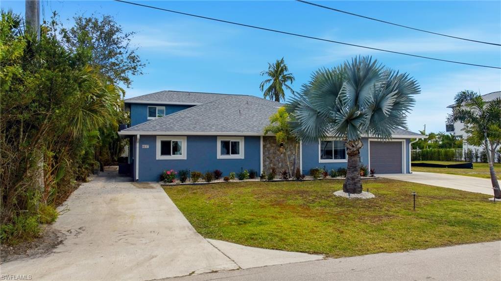 4817-4819 Gary Road Bonita Springs, FL 34134 - Photo 1 of 48 a front view of a house with a yard