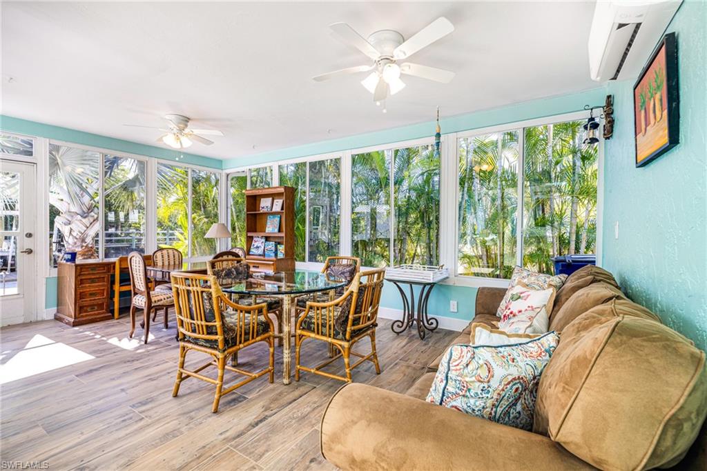 4817-4819 Gary Road Bonita Springs, FL 34134 - Photo 12 of 48 a living room with furniture and a large window
