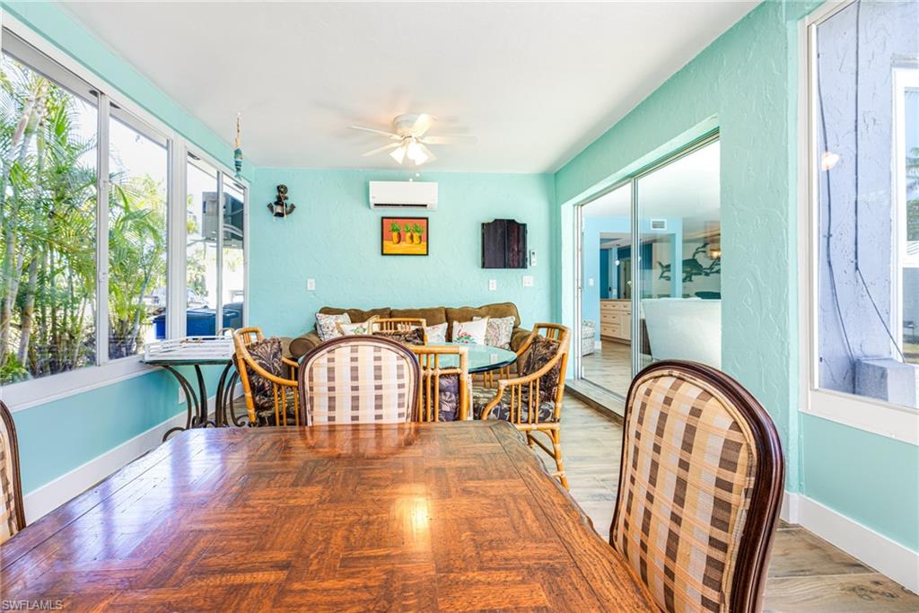 4817-4819 Gary Road Bonita Springs, FL 34134 - Photo 14 of 48 a living room with furniture and a large window