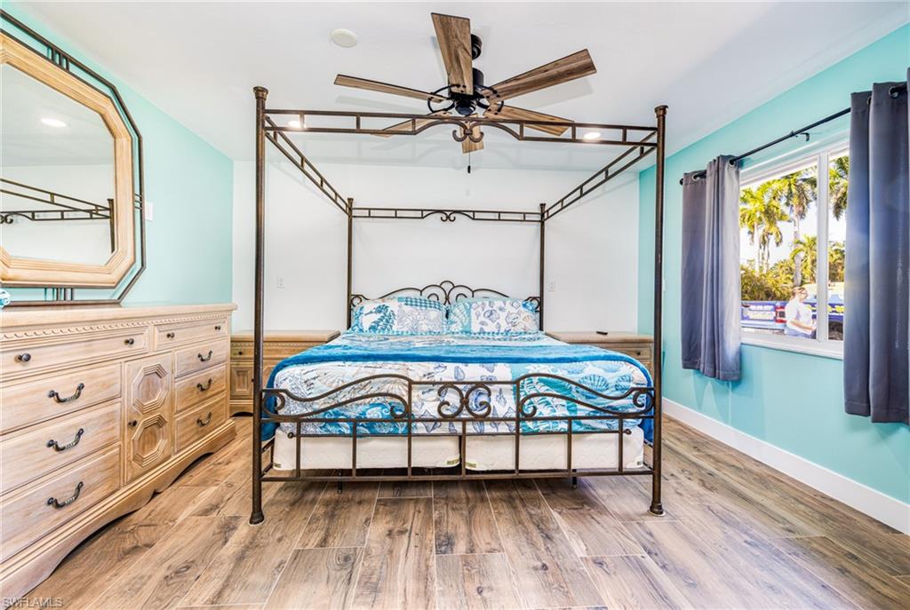 4817-4819 Gary Road Bonita Springs, FL 34134 - Photo 16 of 48 a view of a bedroom with furniture and a window