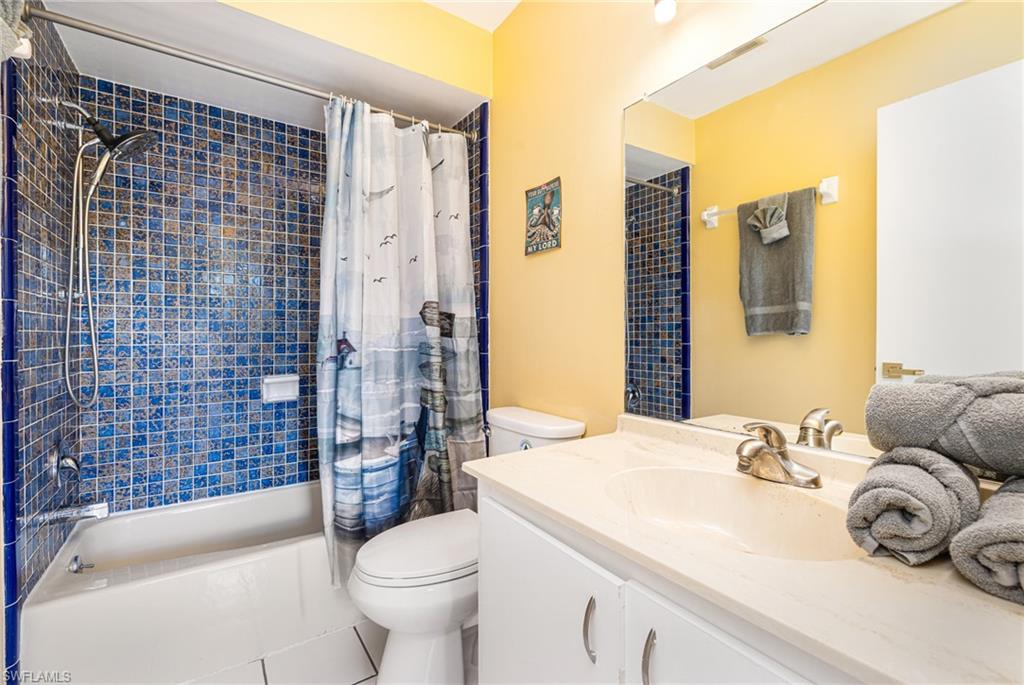 4817-4819 Gary Road Bonita Springs, FL 34134 - Photo 19 of 48 a bathroom with a sink toilet and shower