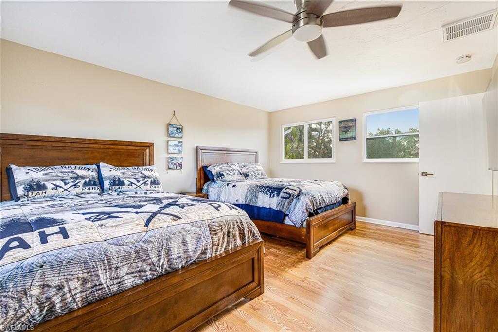 4817-4819 Gary Road Bonita Springs, FL 34134 - Photo 20 of 48 a bedroom with a bed and window