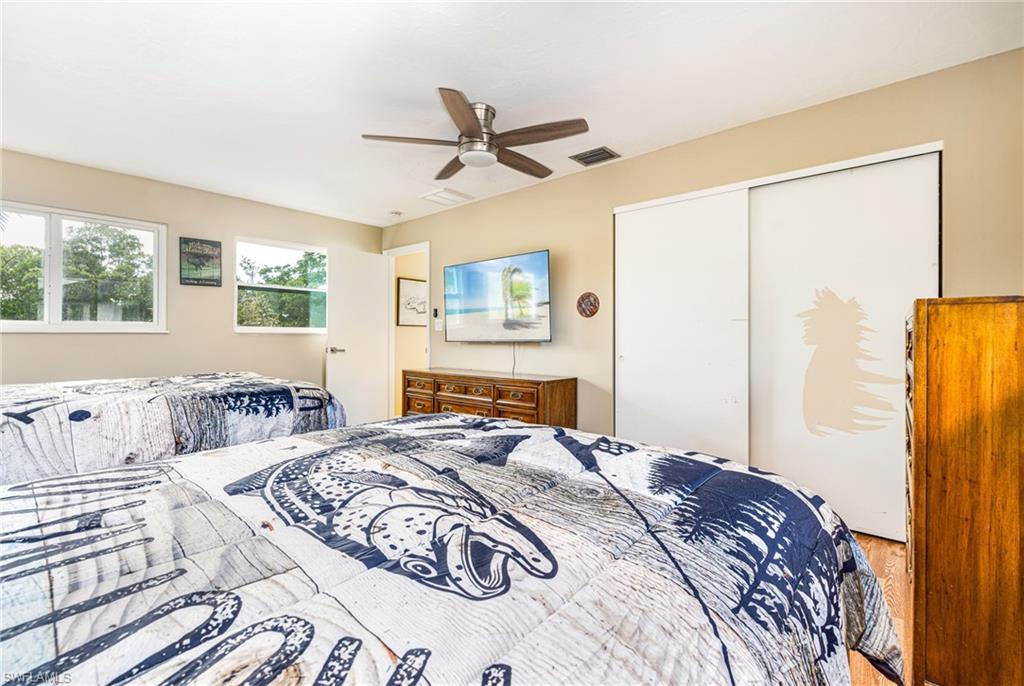 4817-4819 Gary Road Bonita Springs, FL 34134 - Photo 21 of 48 a bedroom with a large bed and a window