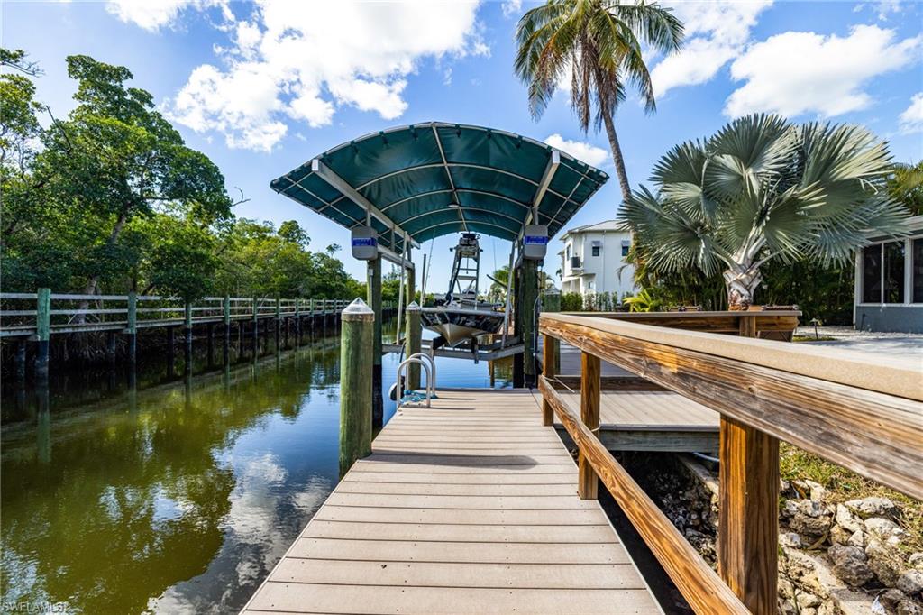 4817-4819 Gary Road Bonita Springs, FL 34134 - Photo 25 of 48 a view of a swimming pool with a patio
